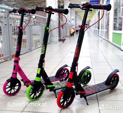 Самокат с ручным тормозом и амортизатором