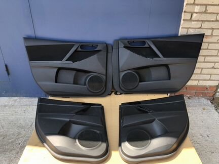 Обшивка двери Mazda 3 BL